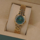 Woman's Golden Chain Watch with Green dial
