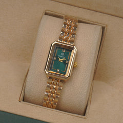 Woman's Golden Chain Watch with green dial